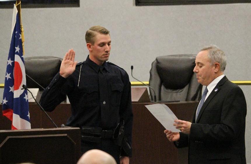 Officer Pete Bronner being sworn in by Mayor Marc Sirkin